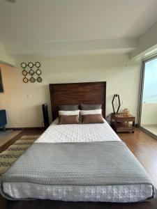 מיטה או מיטות בחדר ב-Cozy apartment near to Costa Rica Airport