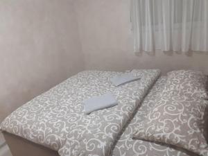 Postel nebo postele na pokoji v ubytování Apartman studio Jovan