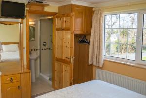 Ένα ή περισσότερα κρεβάτια σε δωμάτιο στο Algret House B&B