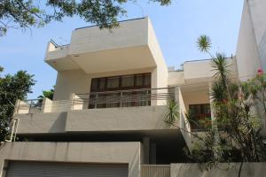 a large white house with a balcony at Occazia Residence in Colombo