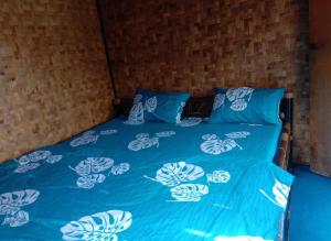 מיטה או מיטות בחדר ב-De Salak Homestay