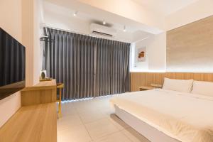 A bed or beds in a room at Shijo Inn