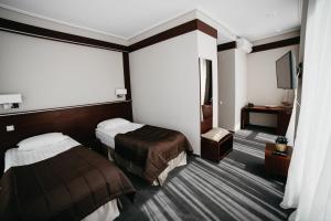 Krevet ili kreveti u jedinici u okviru objekta Cruise Hotel