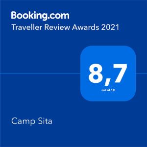 a screenshot of a cell phone with a travel trailer rewards symbol at Camp Sita in Vir