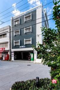a building on the side of a street at Type A Room 120平米 -ウル エスポワール那覇- in Naha