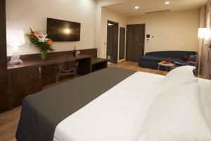 Postel nebo postele na pokoji v ubytování Hotel Concord