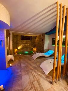 a room with a bed and a stone wall at Aurelia Garden Gold B&B in Rome