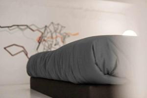 A bed or beds in a room at Almudena Modern & luxury space near Plaza Mayor