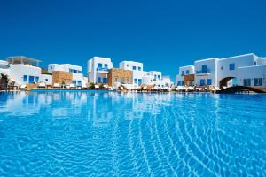 a large swimming pool in front of a resort at Chora Resort Hotel & Spa in Chora Folegandros