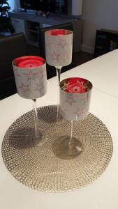 two wine glasses sitting on top of a table at Apart-Hotel-Kick in Sinsheim