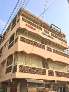 a building with a sign on the side of it at Viriko Boarding House in Mombasa
