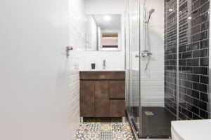 a bathroom with a shower and a sink at Ever House - ALCALA LOFT in Madrid