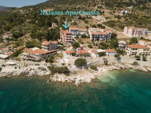 an aerial view of a resort next to the water at Natassa Apartments in Ayia Evfimia