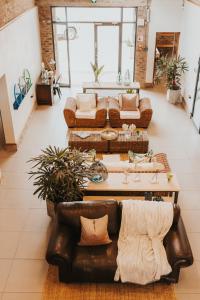 a living room with couches and a coffee table at Execustay in Nelspruit