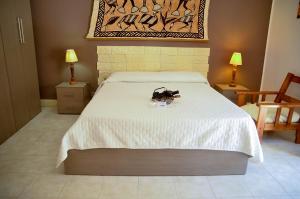 A bed or beds in a room at Noera Home