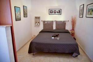 A bed or beds in a room at Noera Home