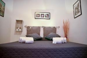 A bed or beds in a room at Noera Home