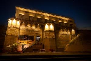 a large building with lights on it at night at Amritara Suryauday Haveli in Varanasi