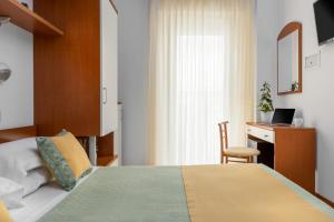 Postel nebo postele na pokoji v ubytování Hotel Principe