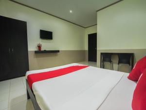Cama o camas de una habitación en OYO 636 Alpha's Place Bed And Breakfast