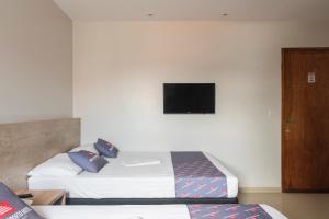 Mega Aeroporto Hotel Apenas 1 km de distância do Aeroporto de Fortaleza客房内的一张或多张床位