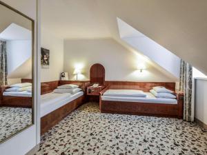 Postel nebo postele na pokoji v ubytování Mercure Grand Hotel Biedermeier Wien