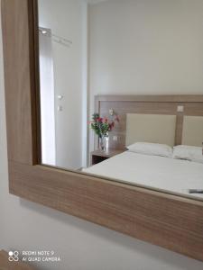 Postel nebo postele na pokoji v ubytování KELLY APARTMENTS