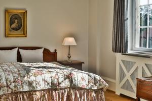 Postel nebo postele na pokoji v ubytování Hotel Fredensborg Store Kro