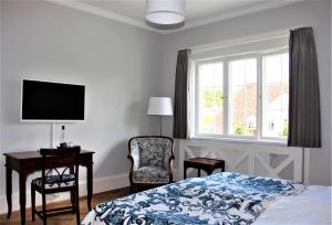 Postel nebo postele na pokoji v ubytování Hotel Fredensborg Store Kro