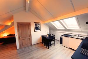 a kitchen and dining room with a table and a window at One bedroom appartement with city view and wifi at Waterloo in Waterloo