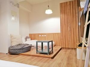 A bed or beds in a room at See U Tainan Apartment