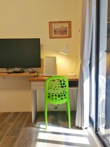 A television and/or entertainment centre at See U Tainan Apartment