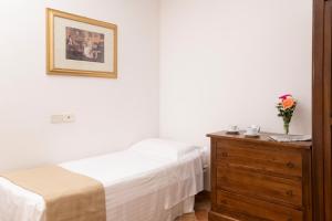 Postel nebo postele na pokoji v ubytování Borgo San Antonio & Borgo San Giuseppe by La Principina