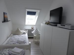 Postel nebo postele na pokoji v ubytování Kajüte 23