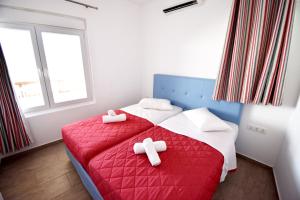 Postel nebo postele na pokoji v ubytování New Paradise