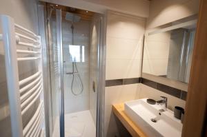 a bathroom with a shower and a sink at Appartements Chalet Le Fornay in Morzine +47 photos