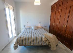 Posteľ alebo postele v izbe v ubytovaní Terraza Trafalgar Apartamento tipo penthouse con enorme terraza y vistas al mar