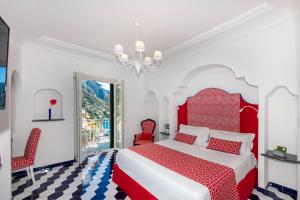 Postel nebo postele na pokoji v ubytování Hotel Reginella