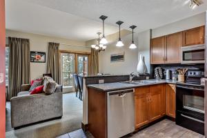 a kitchen with a sink and a counter top at Spacious, Pet Friendly, Townhouse Hot Tub Perfect for Families! in Canmore