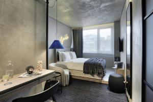 a hotel room with a bed and a desk at ONOMA Hotel in Thessaloniki +78 photos