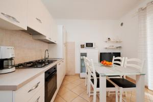 Kuchyňa alebo kuchynka v ubytovaní Apartments Proto