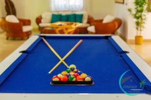 a pool table with balls on top of it at CLOSE TO THE BEACH! LUX VILLA GEMELA, 6Br, 9Bt in Punta Cana