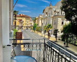 a balcony with a view of a street and buildings at Villa Sokol Apartments Opatija center in Opatija