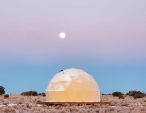 an observatory in the desert with the moon in the sky at Clear Sky Resorts - Grand Canyon - Unique Sky Domes in Valle