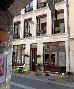 a building with a table in front of it at Les Terrasses de Saillans in Saillans