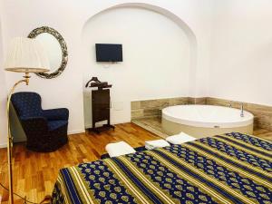 Posteľ alebo postele v izbe v ubytovaní Nerello Suites and Rooms