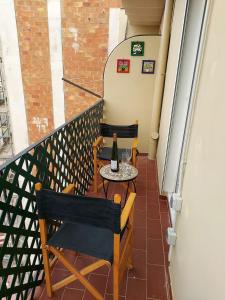 a kitchen with a chair and a table at Economic Fira Suites in Barcelona