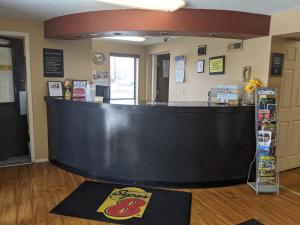 a large black counter in a room at Super 8 by Wyndham Shelbyville in Shelbyville