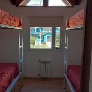 Двухъярусная кровать или двухъярусные кровати в номере Mistico Hostel 23