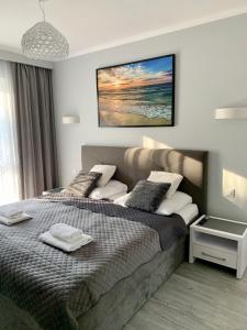 Posteľ alebo postele v izbe v ubytovaní Apartament RELAX